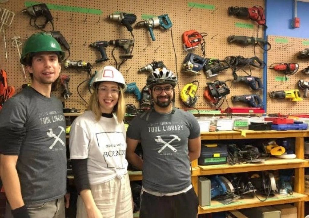 3 people standing in front of tools at the tool library