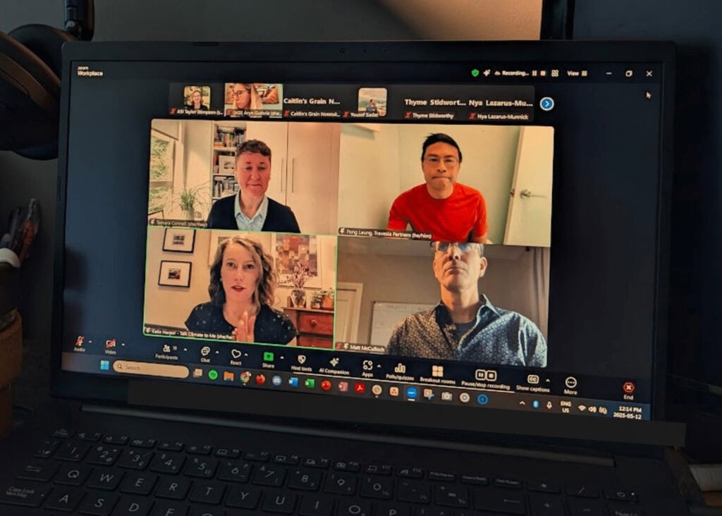 A laptop screen displays a video conference with four people participating, each in their own window. Their varied backgrounds highlight how bridging perspectives can foster collaboration and understanding across distances.